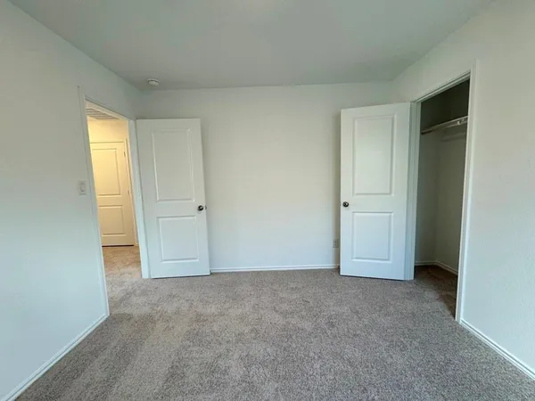 a view of an empty room and window