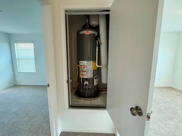 an empty room with an entryway and window