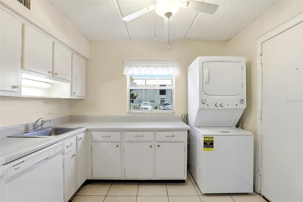 525 South Conway Road, Unit 69 Orlando, FL 32807 - Photo 12 of 25 a utility room with cabinets washer and dryer
