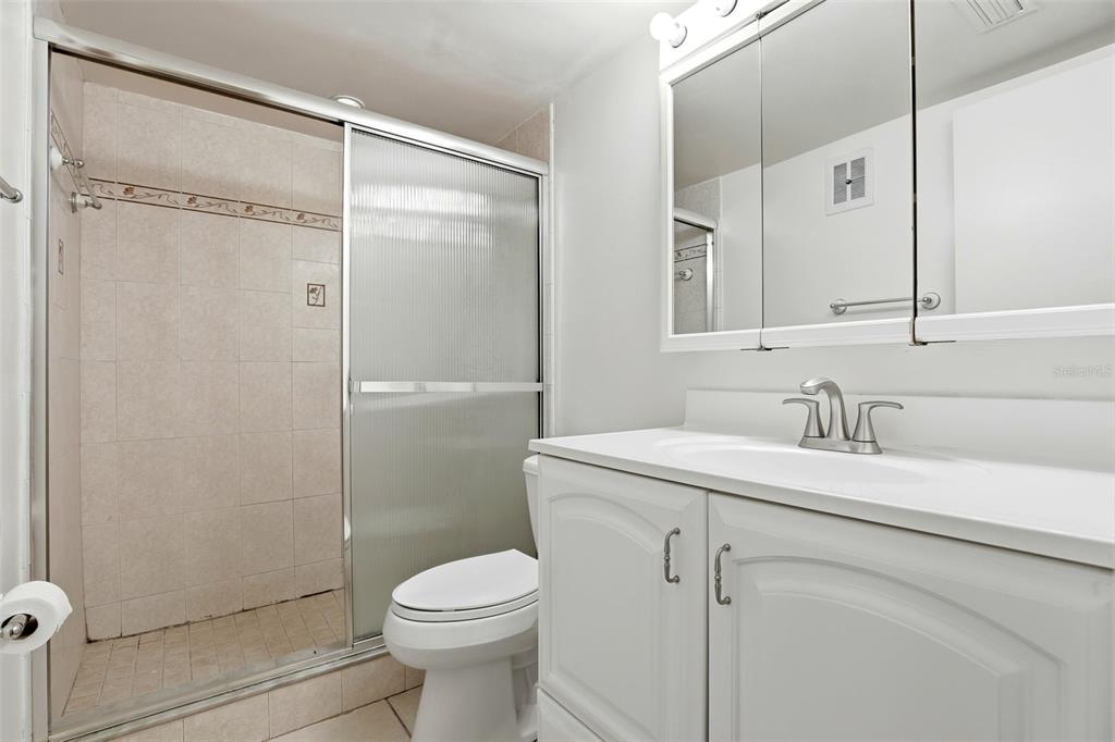 525 South Conway Road, Unit 69 Orlando, FL 32807 - Photo 17 of 25 a bathroom with a sink a toilet and shower