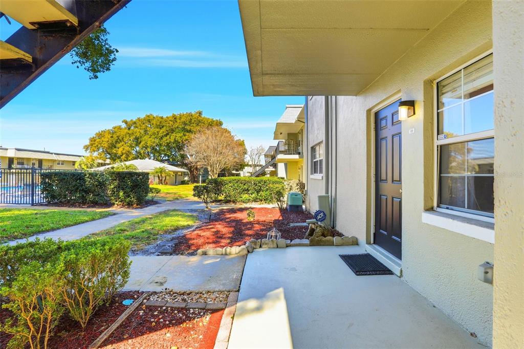 525 South Conway Road, Unit 69 Orlando, FL 32807 - Photo 2 of 25 a view of a patio with table and chairs potted plants