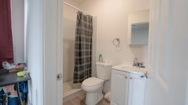 a bathroom with a sink toilet and shower