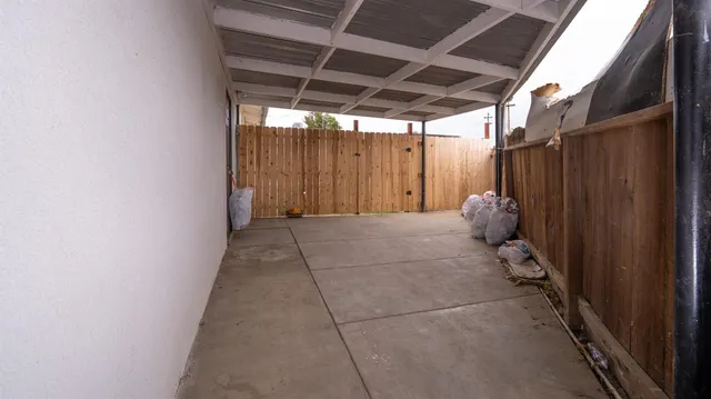 a view of a room with wooden walls