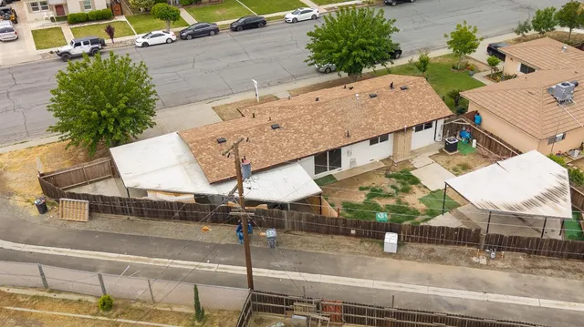 an aerial view of a house with outdoor space