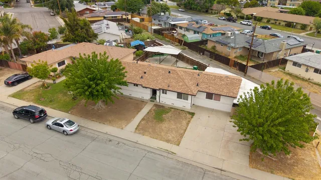 an aerial view of residential houses with outdoor space