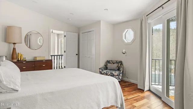 a bedroom with bed and a window