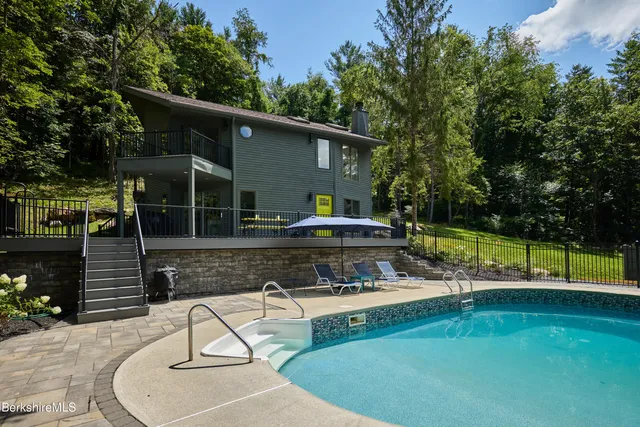 a view of a house with swimming pool