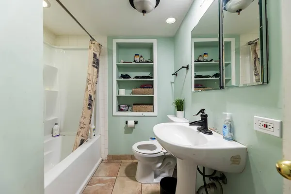 a bathroom with a sink a toilet and a bathtub