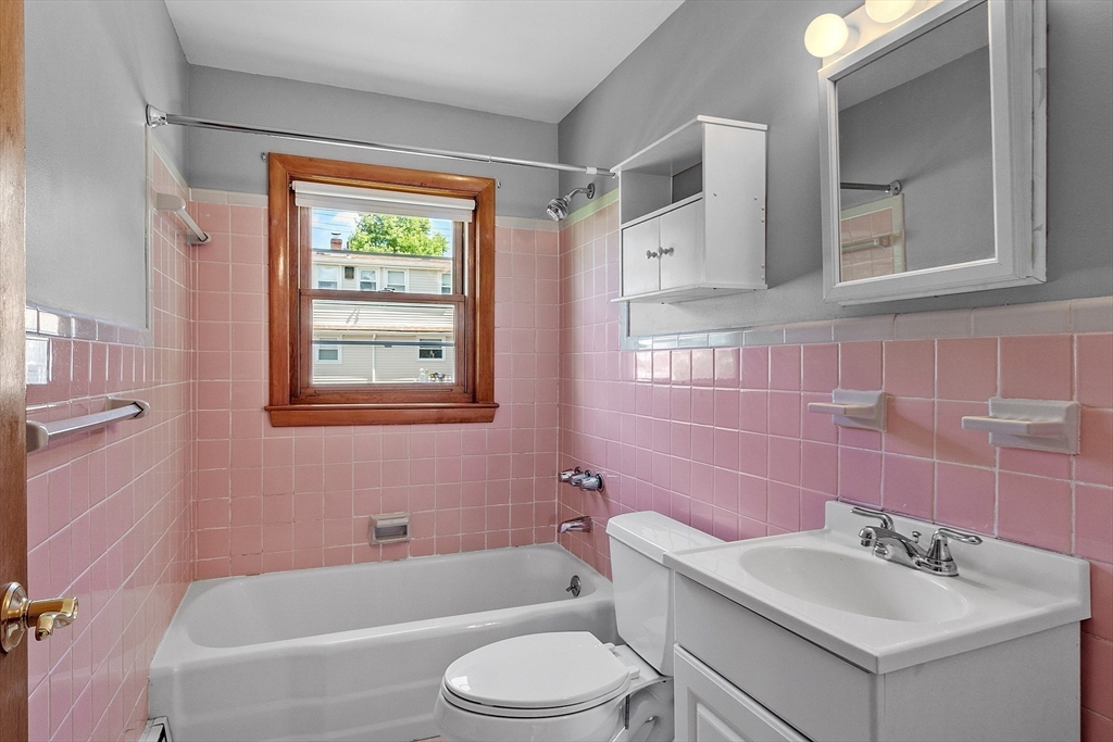 14 Meade Road Waltham, MA 02451 - Photo 12 of 29 a bathroom with a sink toilet tub and shower