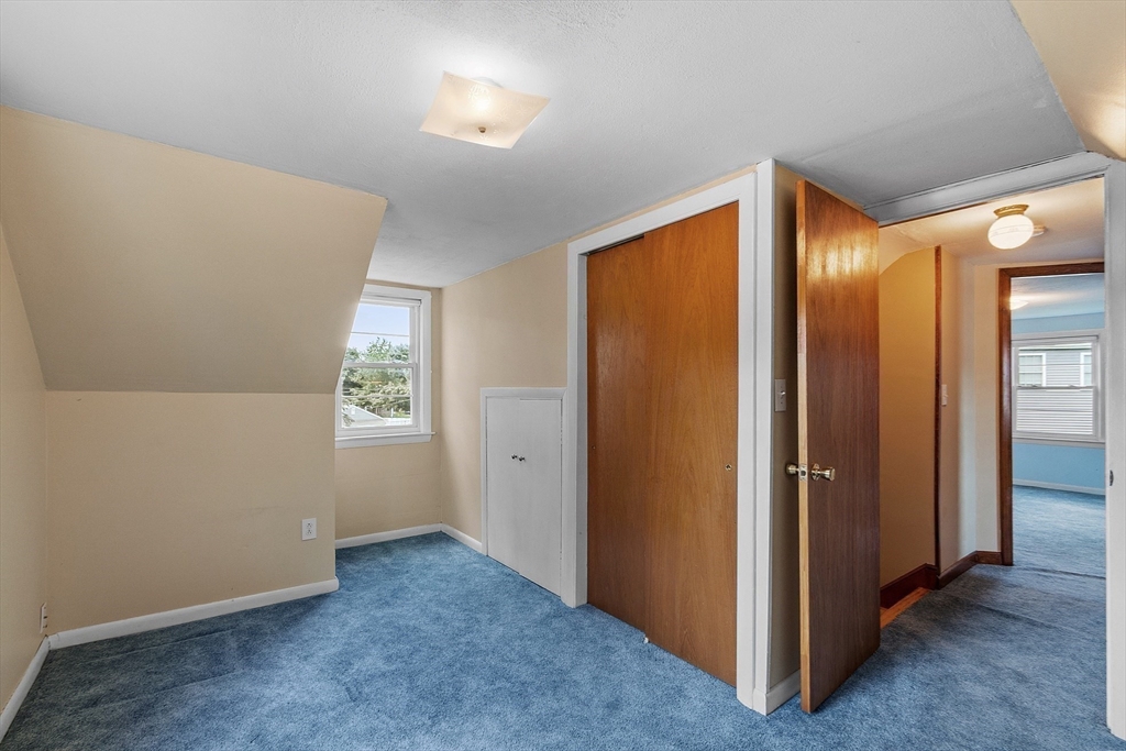 14 Meade Road Waltham, MA 02451 - Photo 16 of 29 an empty room with windows and closet