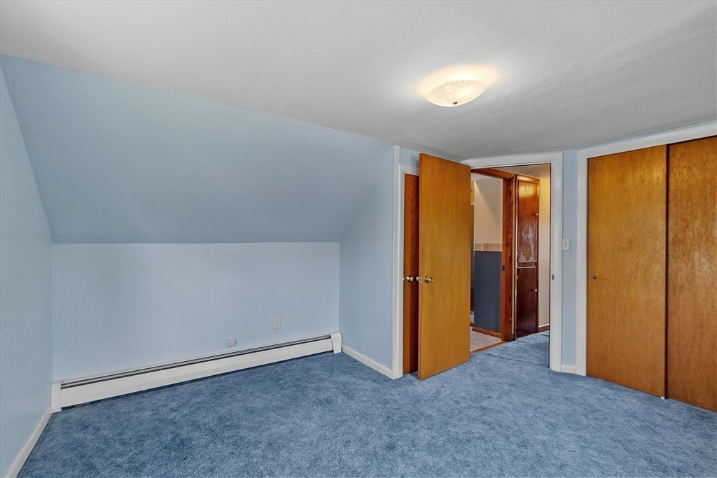 14 Meade Road Waltham, MA 02451 - Photo 19 of 29 an empty room with window and closet area