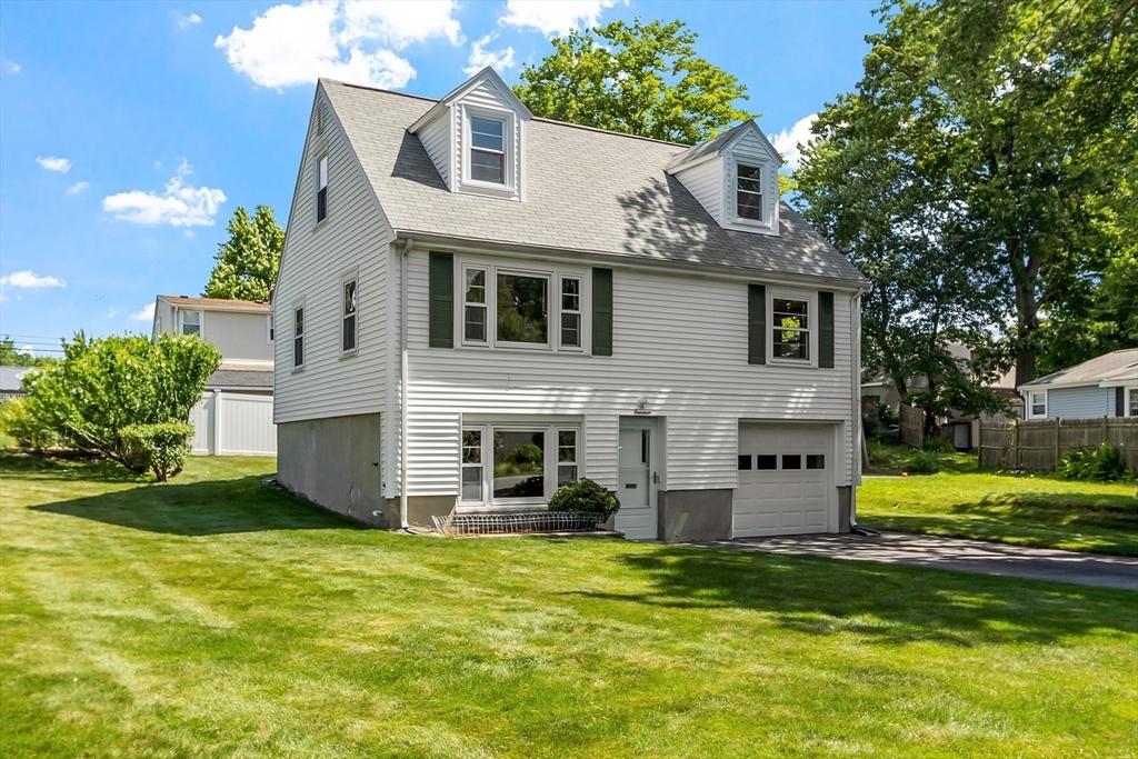 14 Meade Road Waltham, MA 02451 - Photo 2 of 29 a front view of a house with a yard