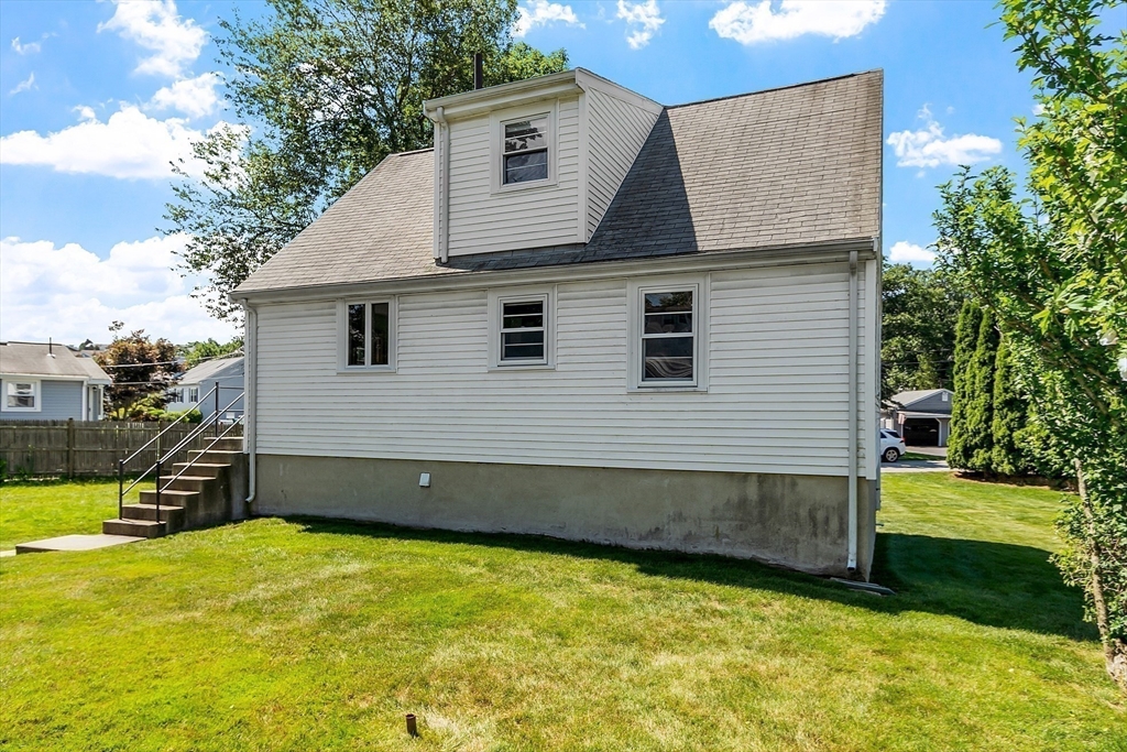 14 Meade Road Waltham, MA 02451 - Photo 26 of 29 a front view of a house with a yard