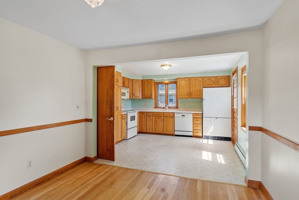 14 Meade Road Waltham, MA 02451 - Photo 7 of 29 a view of a kitchen with wooden floor and a sink