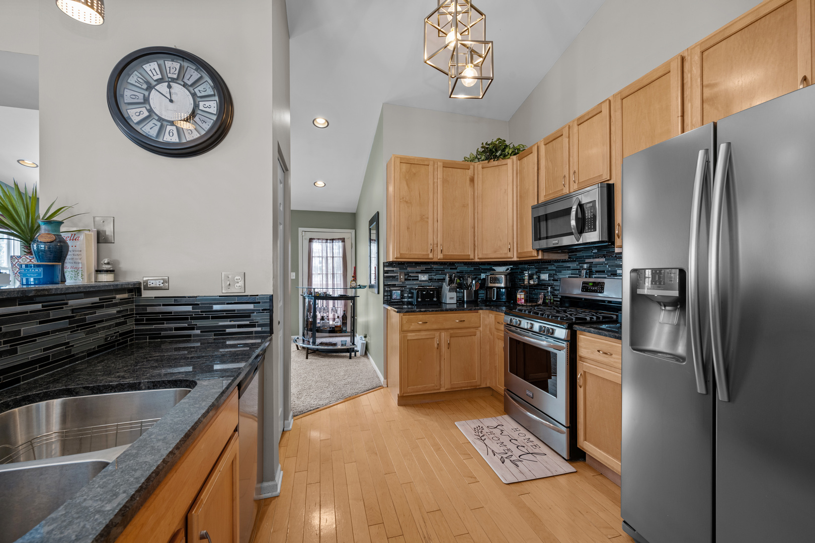 2448 Oneida Lane Naperville, IL 60563 - Photo 12 of 19 a kitchen with stainless steel appliances granite countertop a refrigerator a stove and a sink
