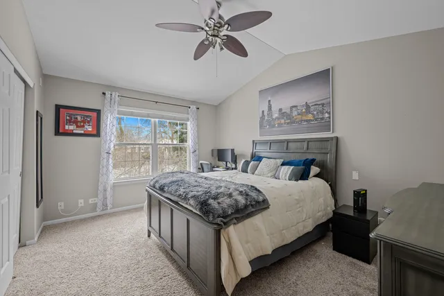 a bedroom with a bed dresser and a window