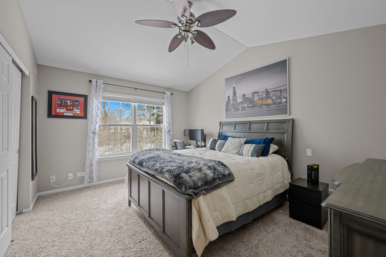 2448 Oneida Lane Naperville, IL 60563 - Photo 13 of 19 a bedroom with a bed dresser and a window
