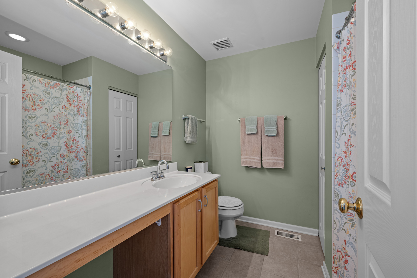 2448 Oneida Lane Naperville, IL 60563 - Photo 14 of 19 a bathroom with a sink a toilet tub and shower