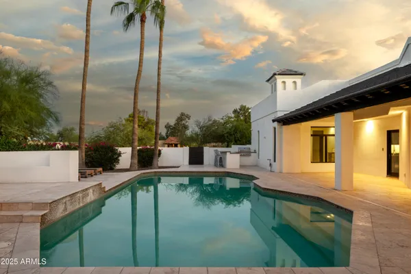 a utility room with sink dryer and washer
