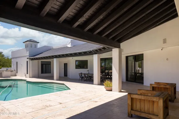 a view of a balcony with chairs