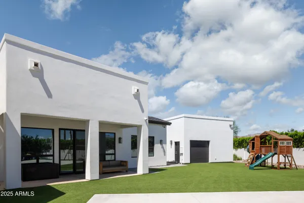 a terrace of a house with outdoor seating
