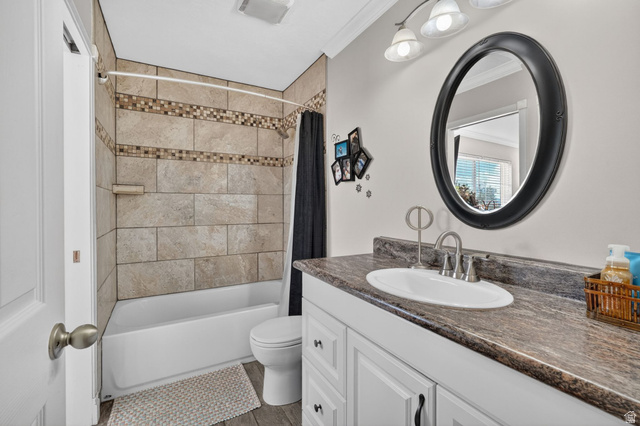 415 East 400 North Santaquin, UT 84655 - Photo 17 of 39 Bathroom featuring a white vanity with paneling and dark hardware, an oval sink with a brushed nickel faucet, and a dark patterned countertop
