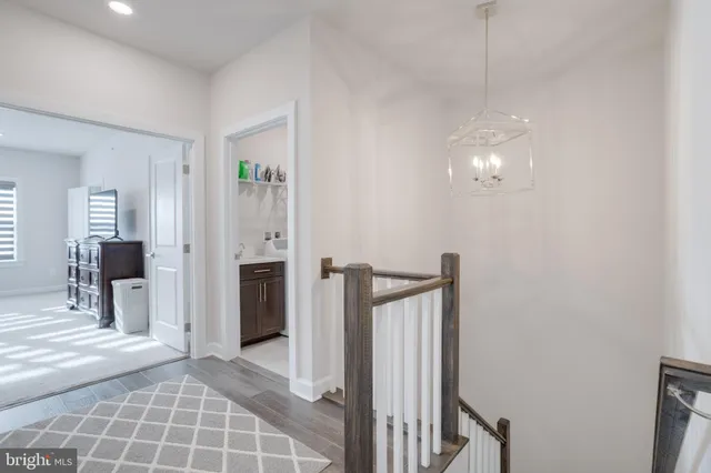 a bathroom with a sink double vanity granite and a toilet
