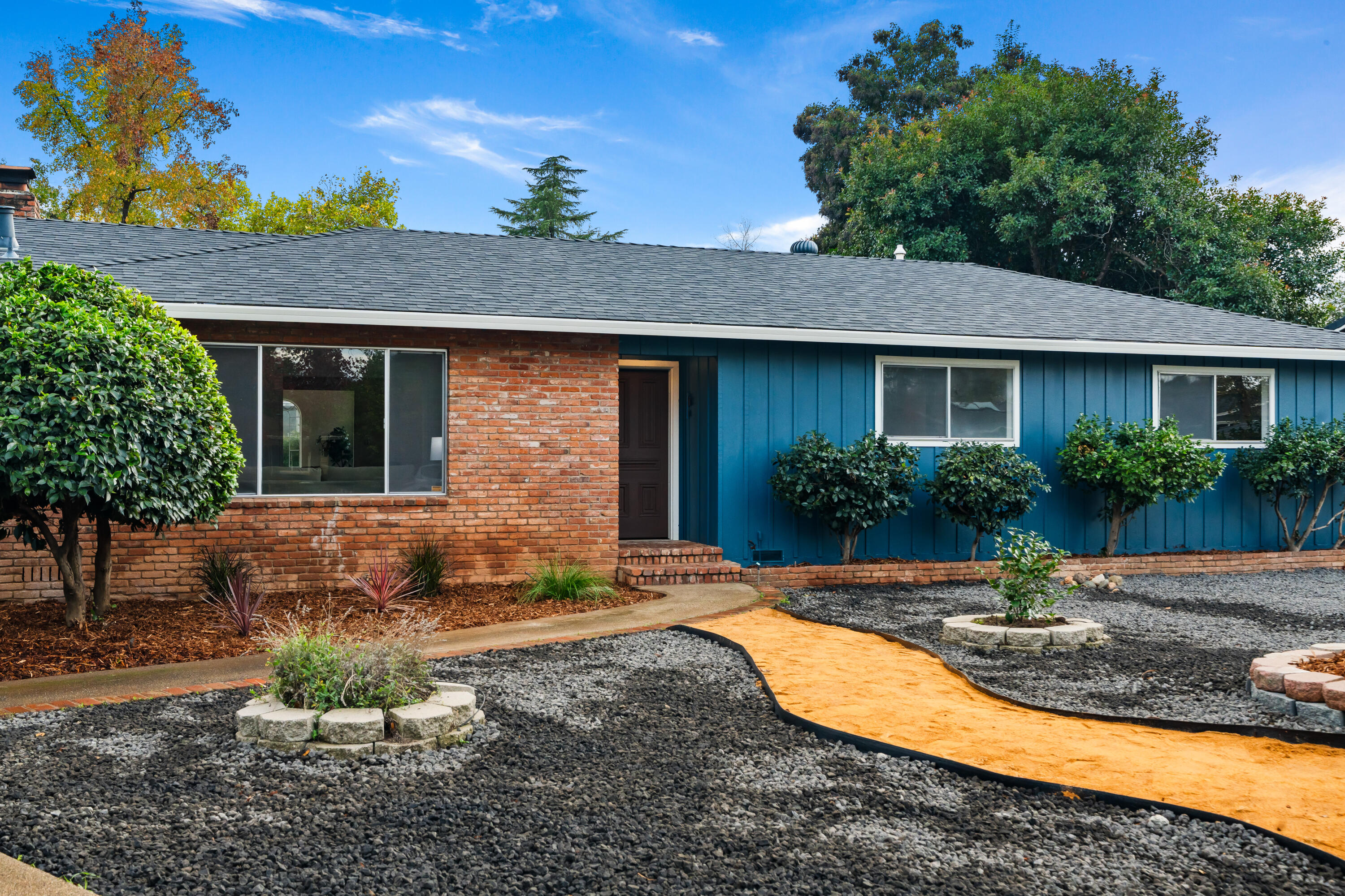 595 Rafael Street Redding, CA 96002 - Photo 2 of 54 a view of a house with yard and plants