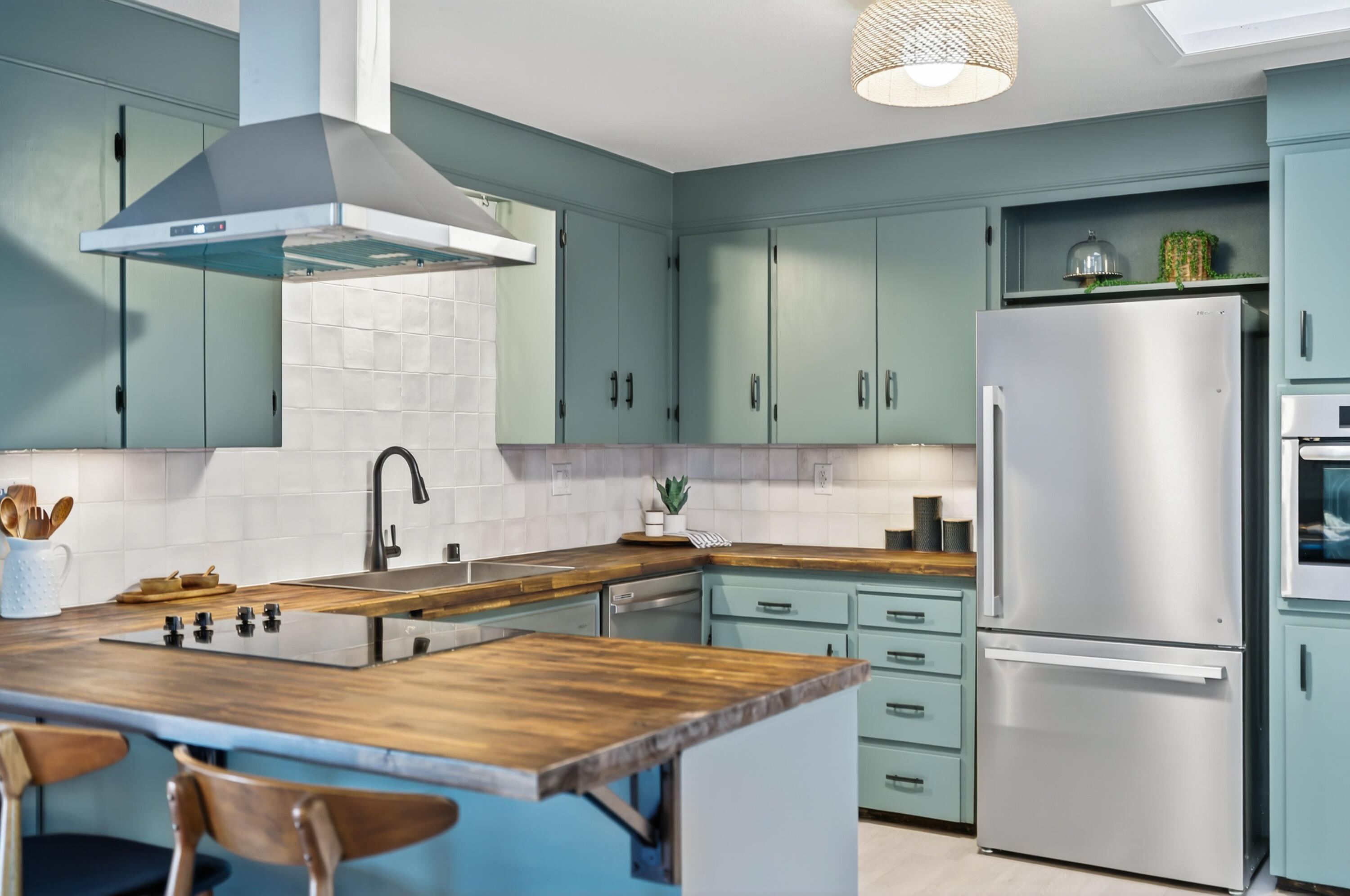 595 Rafael Street Redding, CA 96002 - Photo 22 of 54 a kitchen with stainless steel appliances granite countertop a sink refrigerator and cabinets