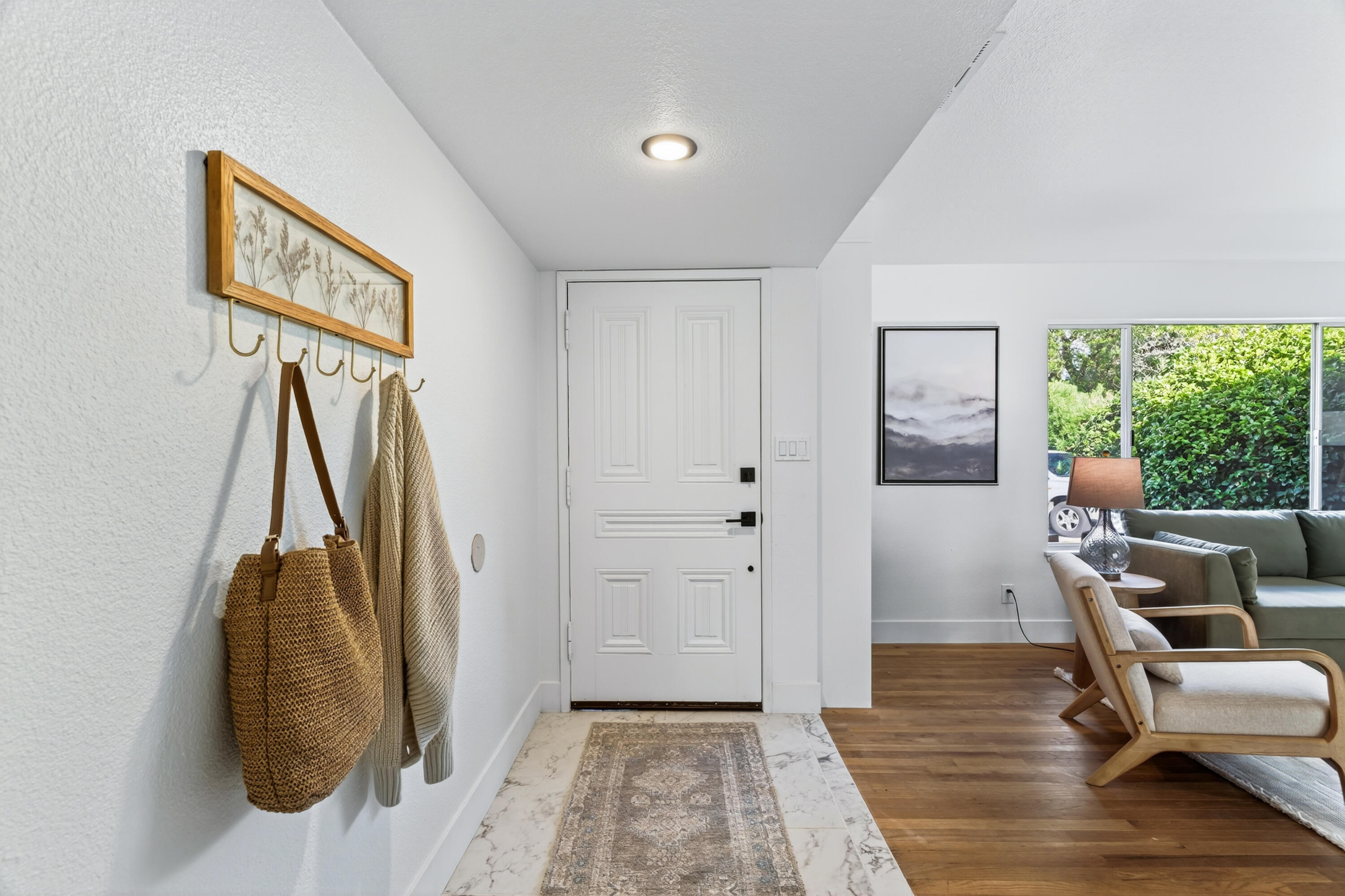 595 Rafael Street Redding, CA 96002 - Photo 28 of 54 a view of a hallway with furniture and a window