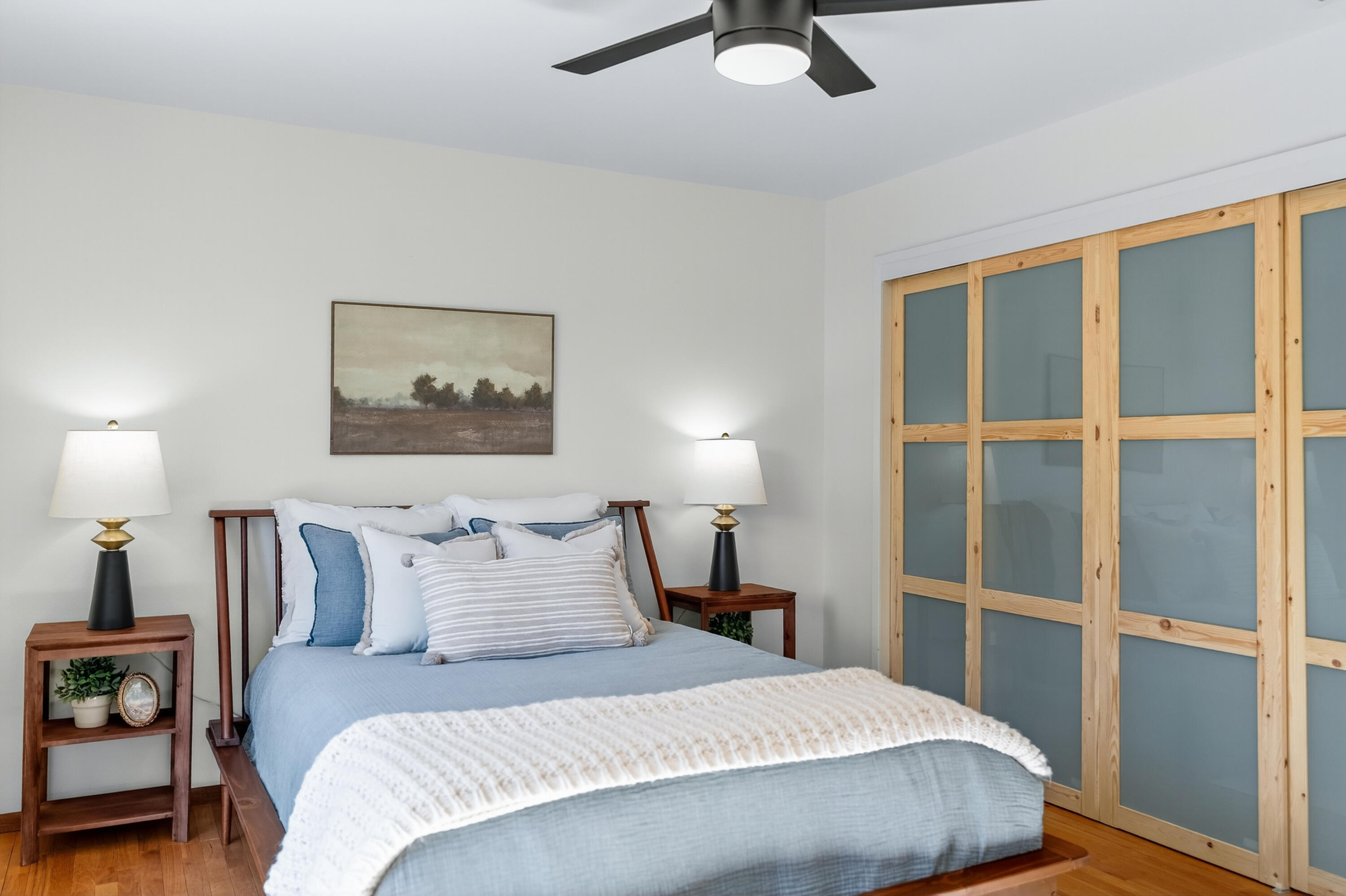 595 Rafael Street Redding, CA 96002 - Photo 32 of 54 a bedroom with a bed and a painting on the wall