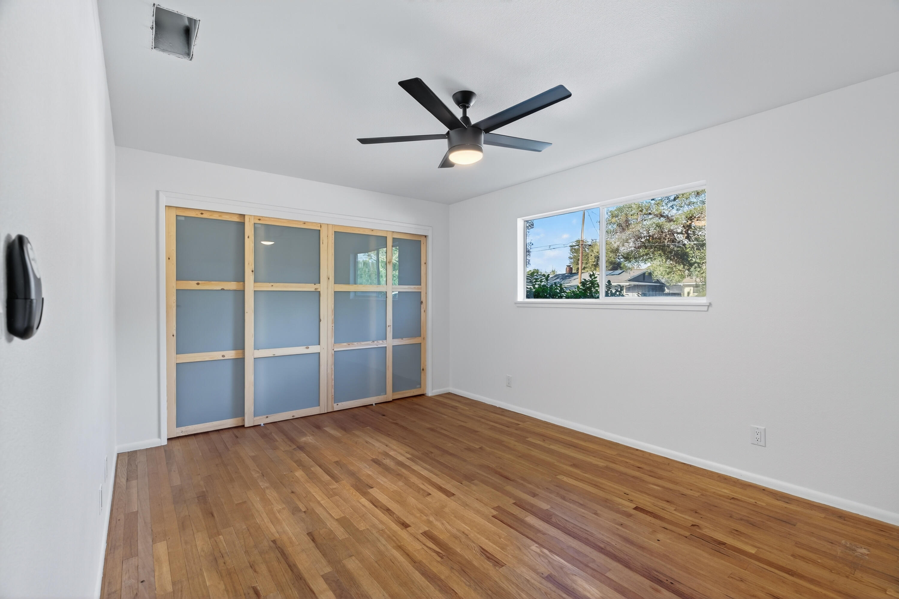 595 Rafael Street Redding, CA 96002 - Photo 38 of 54 a view of empty room with wooden floor and ceiling fan