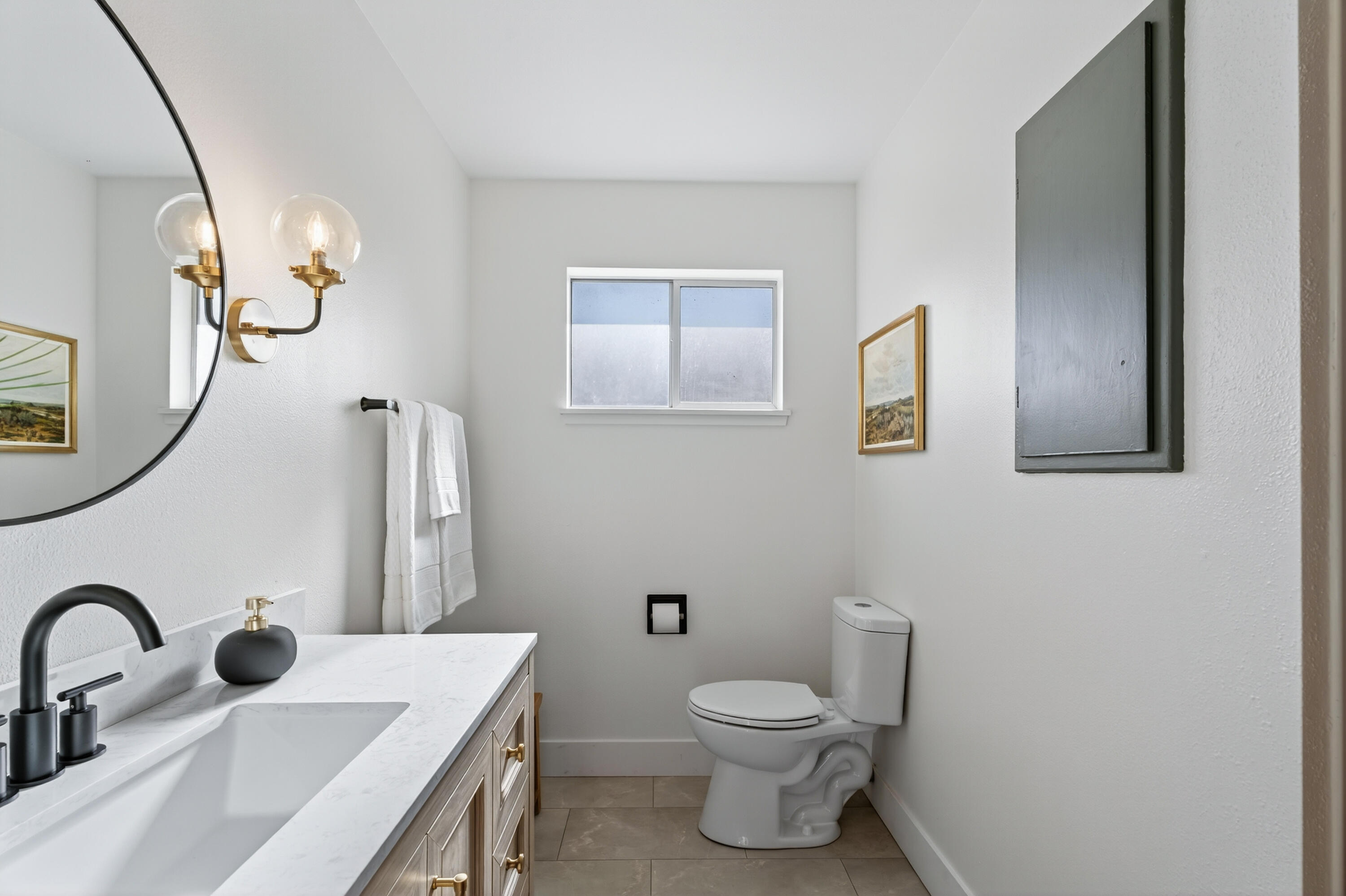 595 Rafael Street Redding, CA 96002 - Photo 40 of 54 a bathroom with a sink a toilet and a mirror