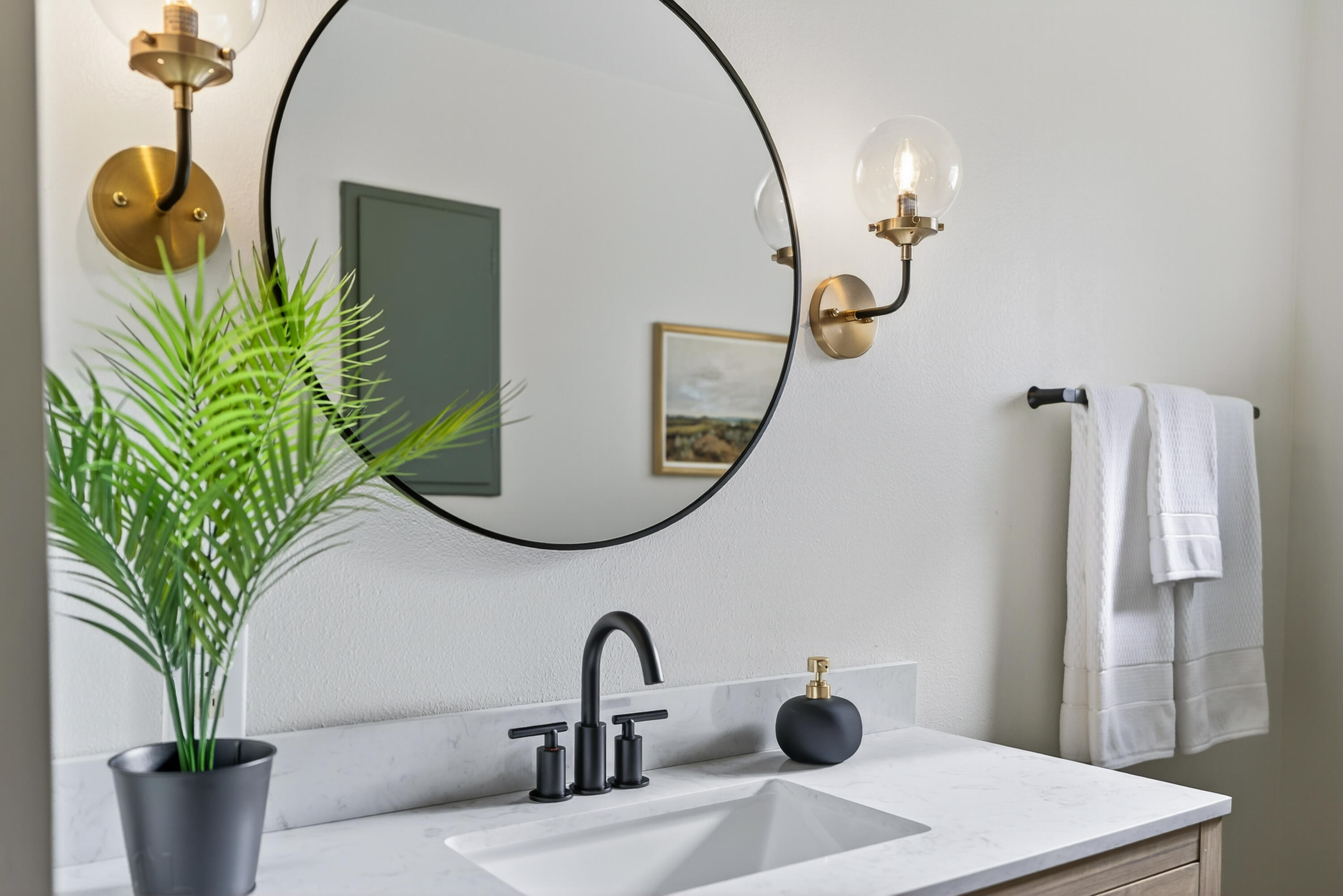 595 Rafael Street Redding, CA 96002 - Photo 41 of 54 a bathroom with a sink a potted plant and a mirror