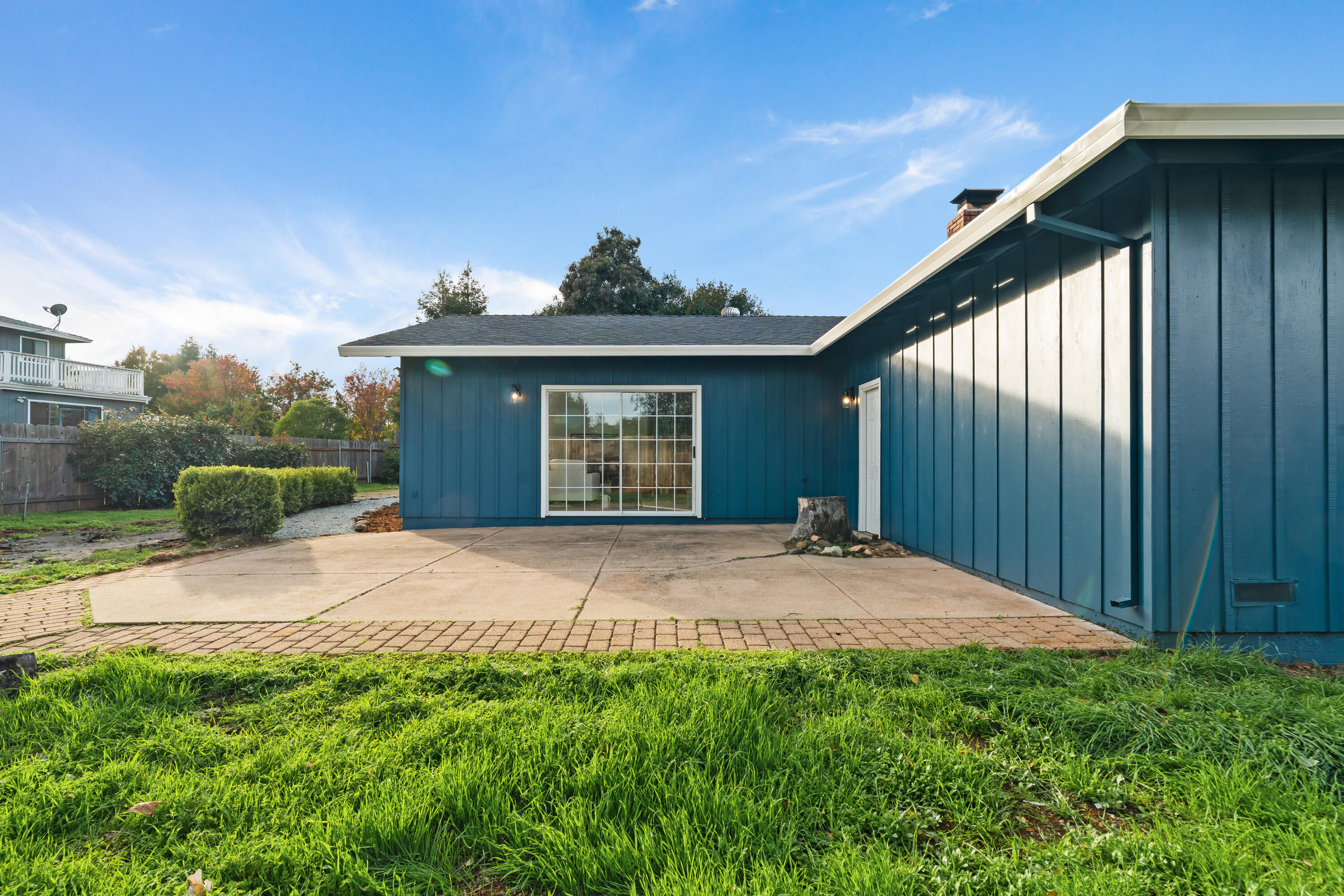595 Rafael Street Redding, CA 96002 - Photo 47 of 54 a front view of a house with a yard and garage