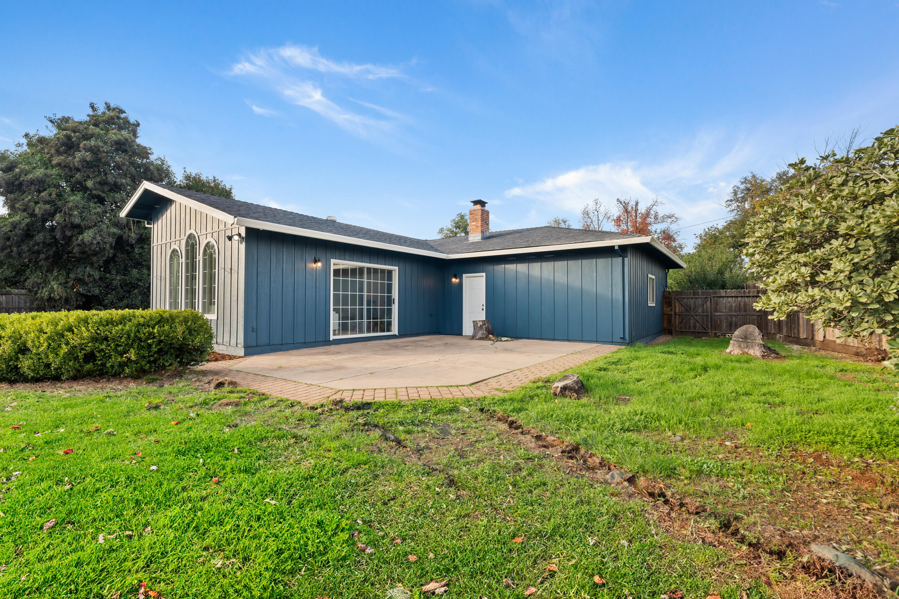 595 Rafael Street Redding, CA 96002 - Photo 49 of 54 a front view of a house with yard and garage
