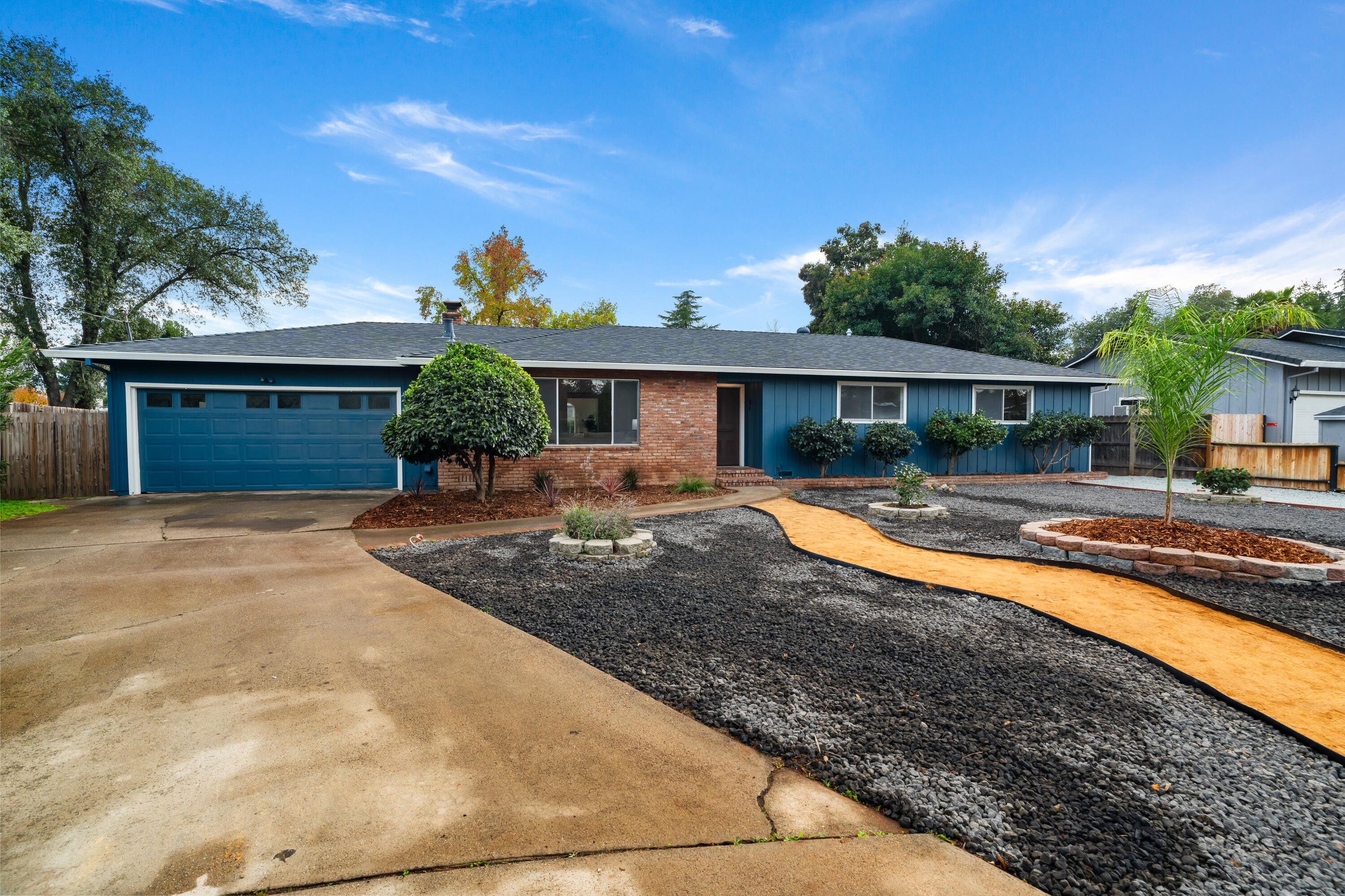 595 Rafael Street Redding, CA 96002 - Photo 5 of 54 a front view of a house with a yard