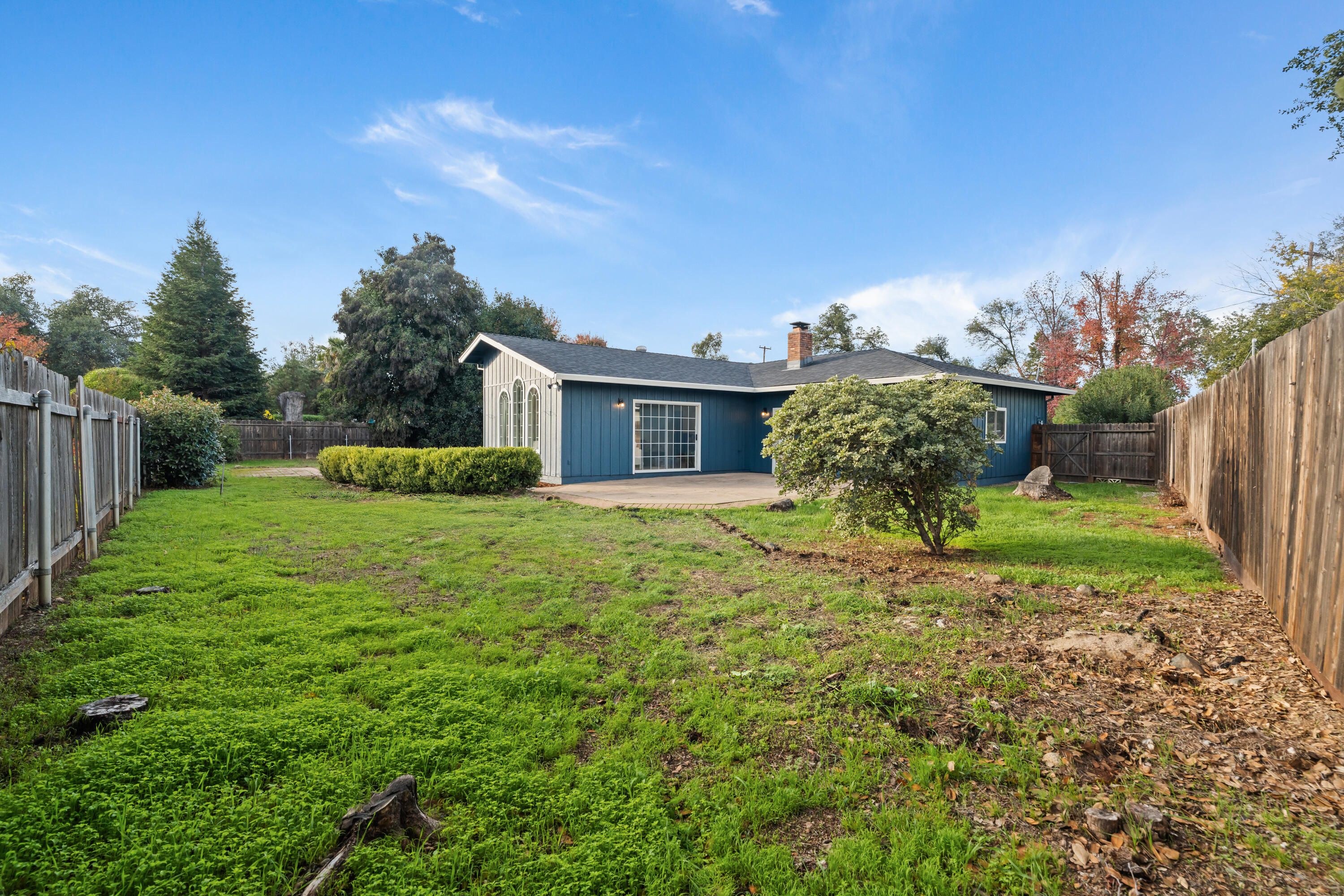 595 Rafael Street Redding, CA 96002 - Photo 53 of 54 a house with green field in front of it