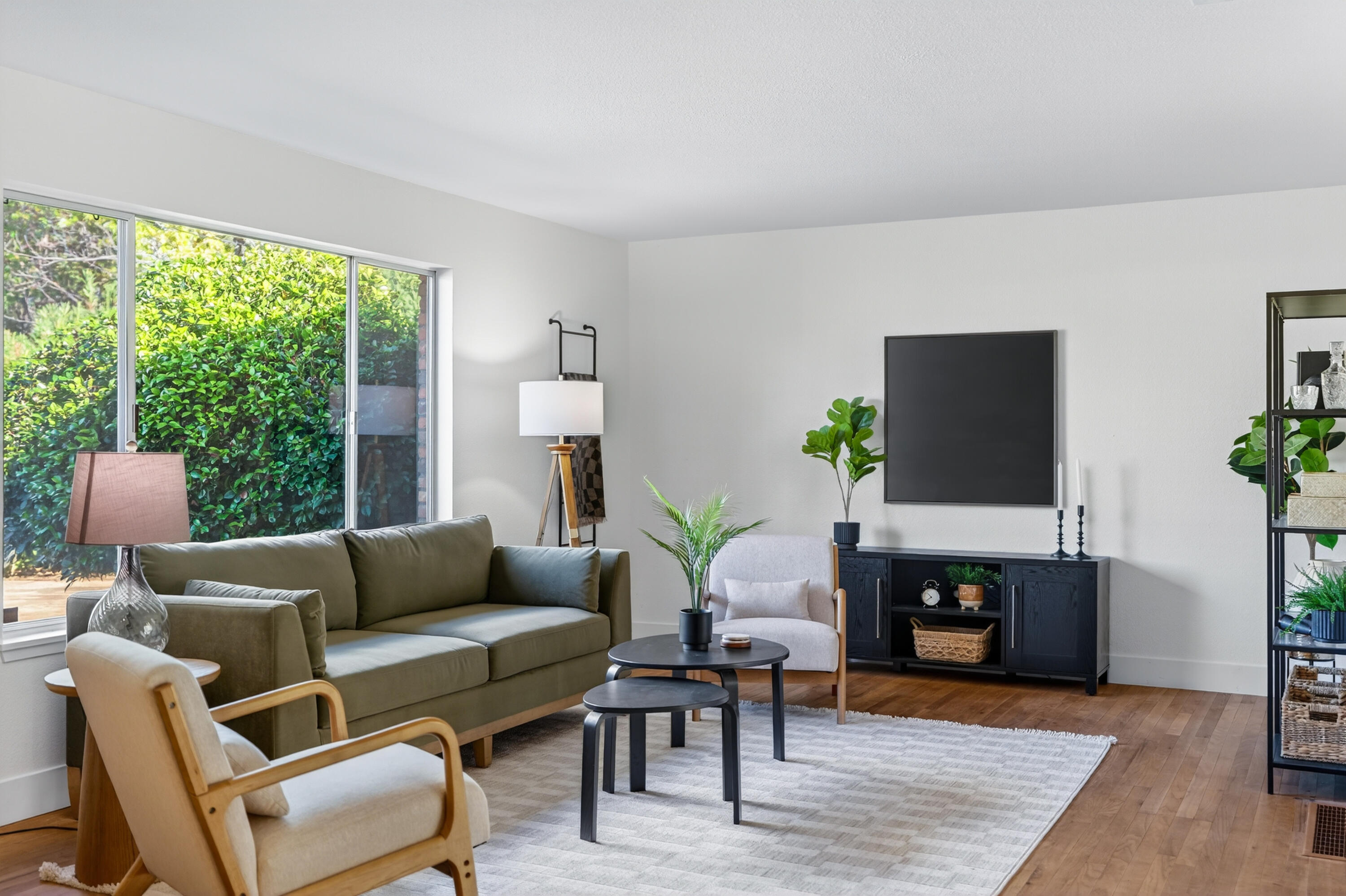 595 Rafael Street Redding, CA 96002 - Photo 6 of 54 a living room with furniture a large window and a fireplace