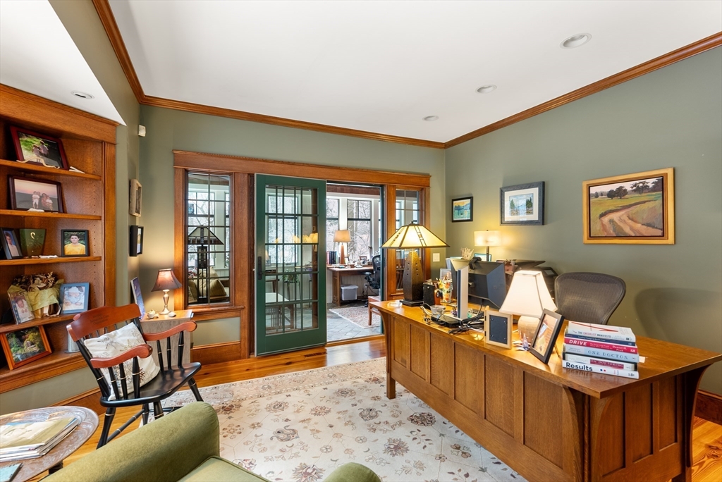 32 Standish Circle Wellesley, MA 02481 - Photo 12 of 41 a living room with furniture a rug and a bookshelf