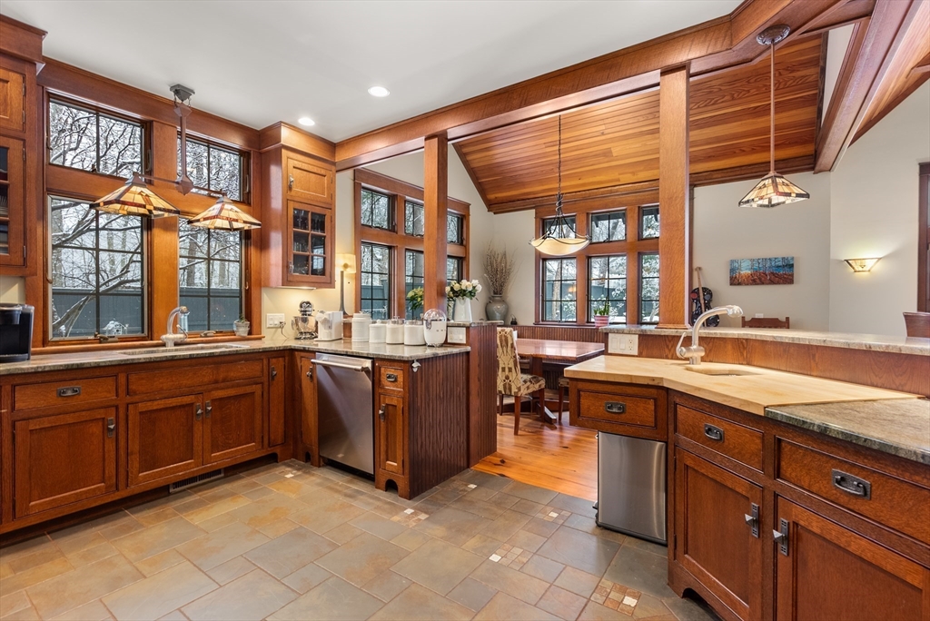 32 Standish Circle Wellesley, MA 02481 - Photo 7 of 41 a large kitchen with stainless steel appliances granite countertop a sink and cabinets
