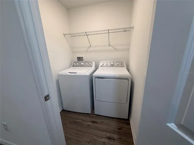 a utility room with dryer and washer