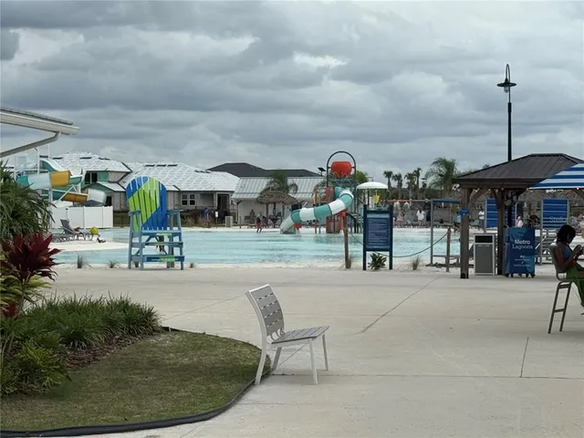 a view of a backyard with sitting area