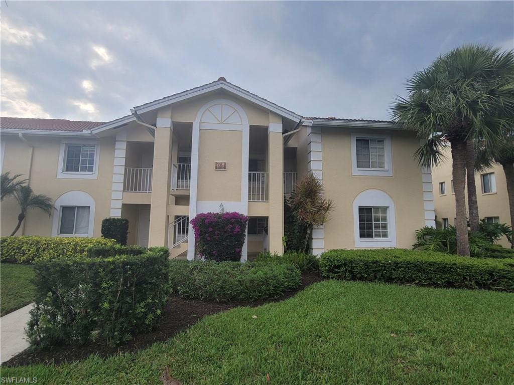 7731 Jewel Lane, Unit 204 Naples, FL 34109 - Photo 1 of 29 a front view of a house with a yard