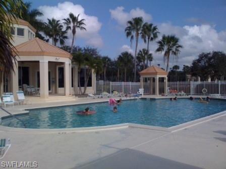 7731 Jewel Lane, Unit 204 Naples, FL 34109 - Photo 28 of 29 a view of a swimming pool with a patio
