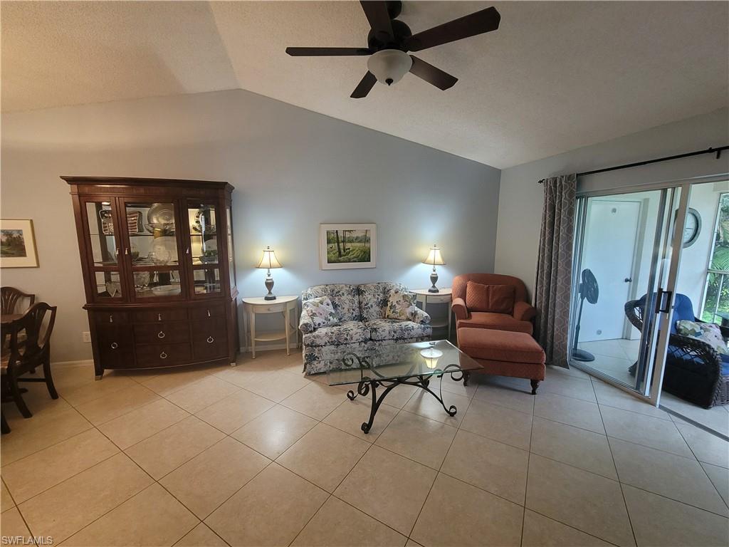 7731 Jewel Lane, Unit 204 Naples, FL 34109 - Photo 4 of 29 a living room with furniture and a window