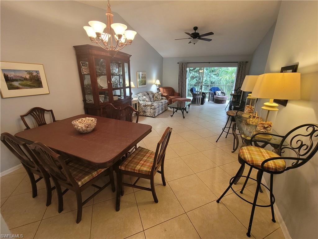 7731 Jewel Lane, Unit 204 Naples, FL 34109 - Photo 8 of 29 a view of a dining room with furniture and a chandelier