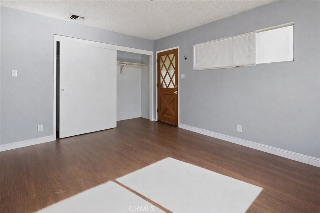 404 South 3rd Street Montebello, CA 90640 - Photo 11 of 29 a view of an empty room with wooden floor and closet