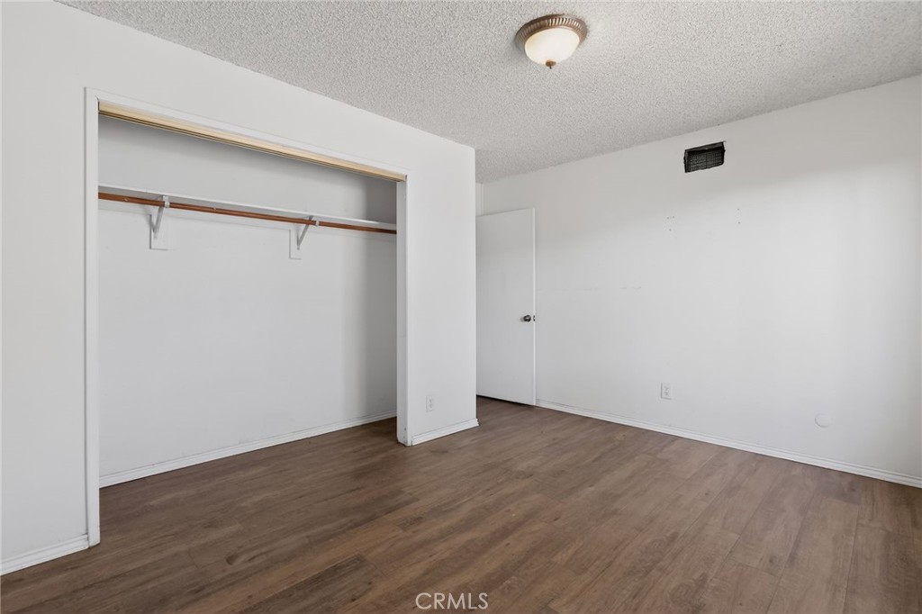 404 South 3rd Street Montebello, CA 90640 - Photo 13 of 29 a view of an empty room with wooden floor