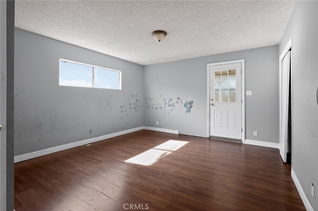 404 South 3rd Street Montebello, CA 90640 - Photo 15 of 29 a view of empty room with wooden floor